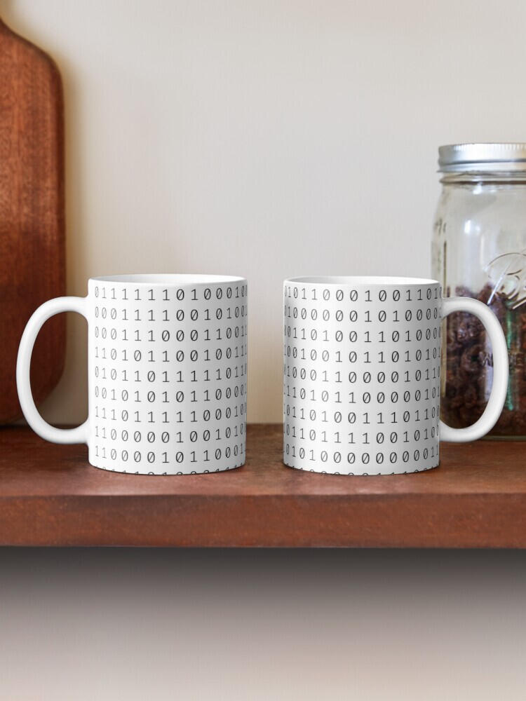 A pair of white mugs with black 0s and 1s all over